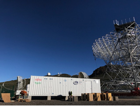 Photo 1: Exterior of the container housing system (telescope in photo is under construction)