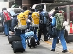 Staff walking in with backpacks