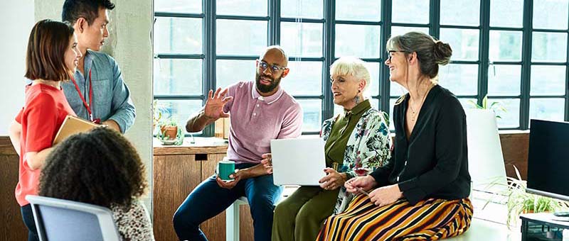 group of people discussing in office