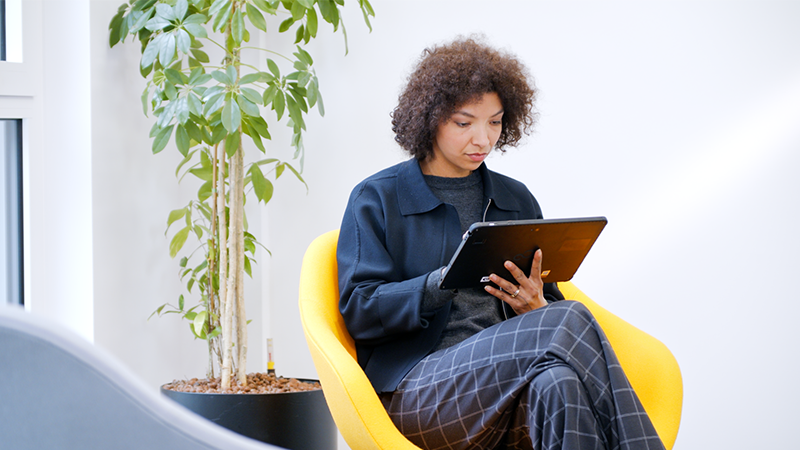 Woman looking at stylistic tablet