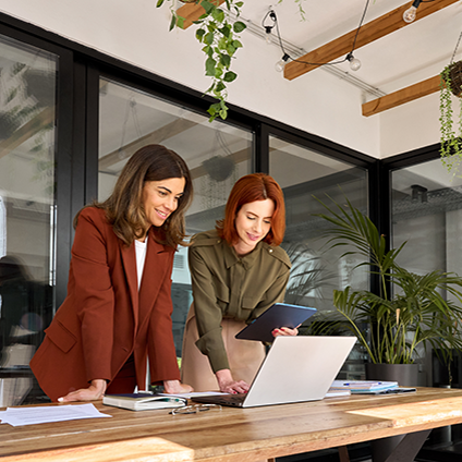 Two women working at a green office 