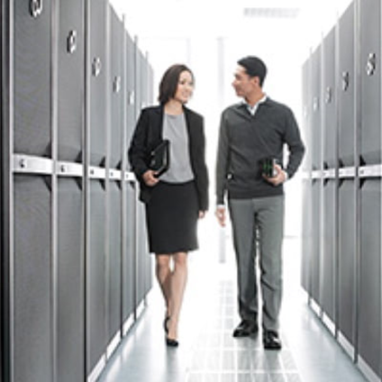 Two colleagues in a data centre