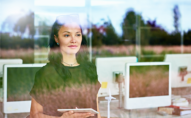 Lady looking outside through glass