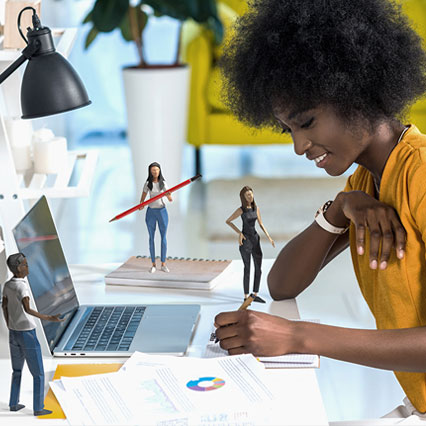 woman working next to origami figures