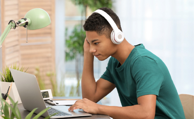 Young man working with notebook computer 