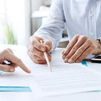 Two people checking a document