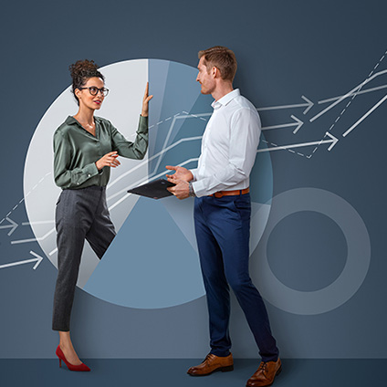 Two people talking in front of an abstract large diagram background