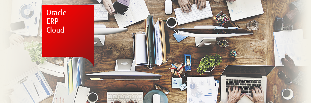 Photo of people working around a table on a variety of desktop and mobile devices