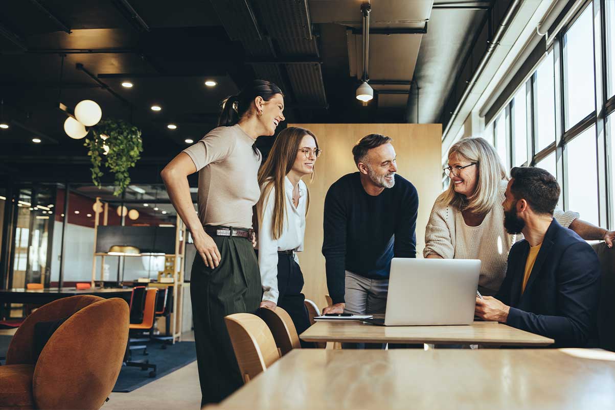 smiling businesspeople having a discussion in a modern workspace