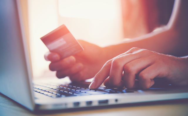 Photo of person paying for something online by credit card