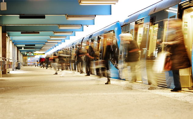 Photo of people getting off a train.