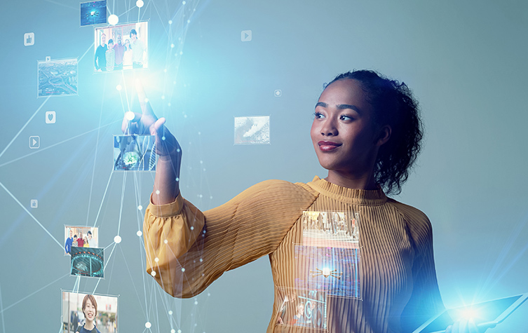 A woman holding a tablet displaying a digital image.