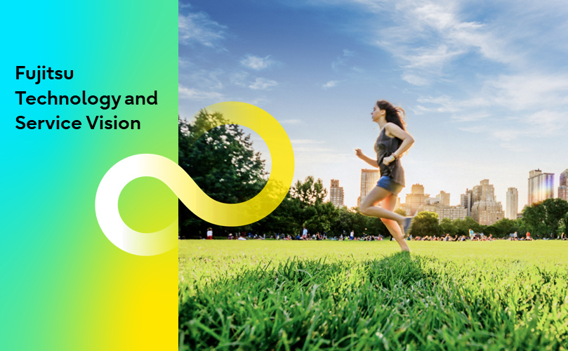 A woman running in a park with a city skyline in the background.