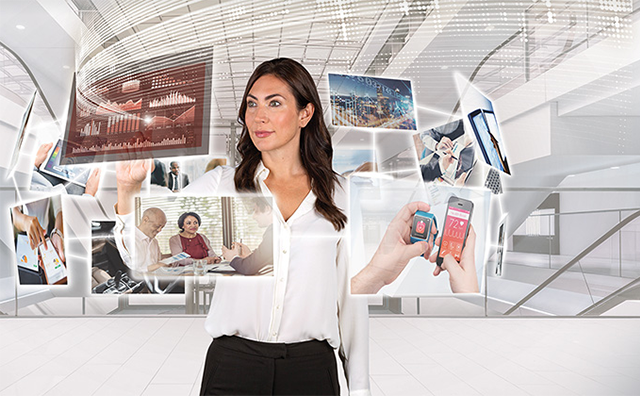 Photo of a woman in an office manipulating virtual screens