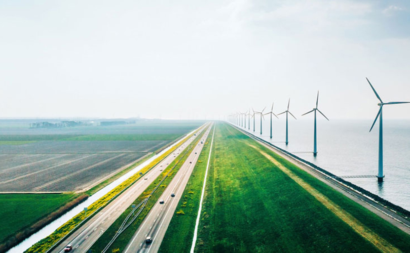 highway with green field and wind mills