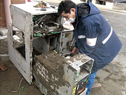 A repair worker fixing some hardware