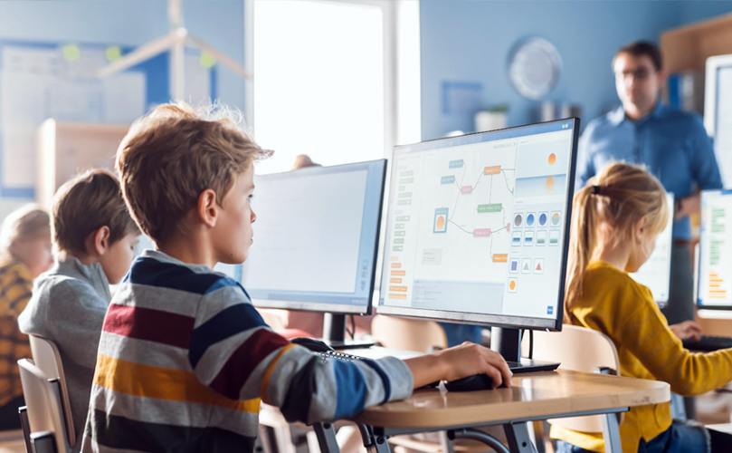 a group of kids using computers