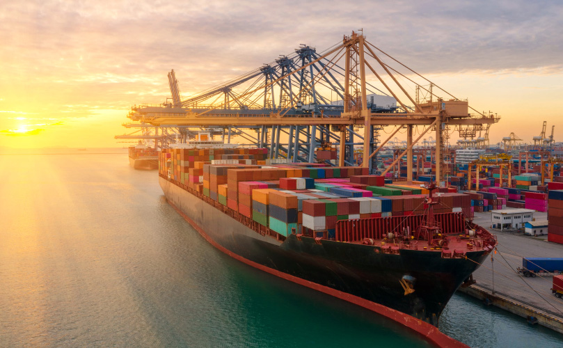 a large cargo ship with containers on the side