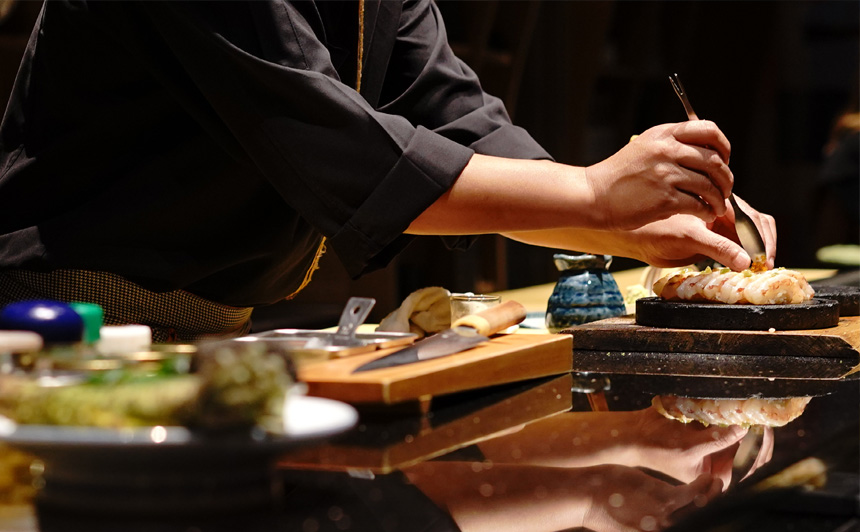a person cooking food on a table