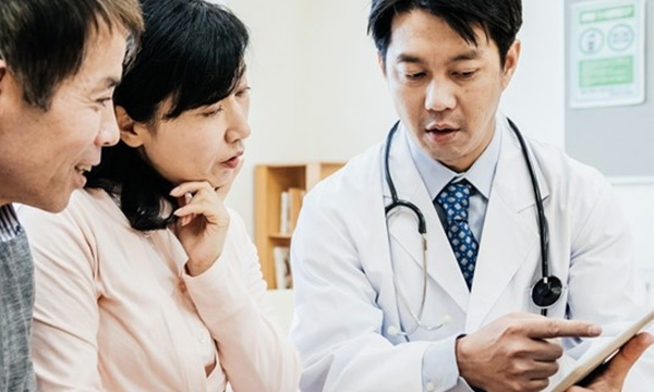 Couple having a consultation with a doctor.