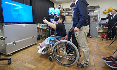 Person in a wheelchair enjoying a virtual experience.