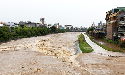 Buildings surrounded by flood waters.