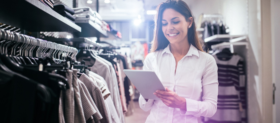 Retail employee checking stock information in store on a tablet