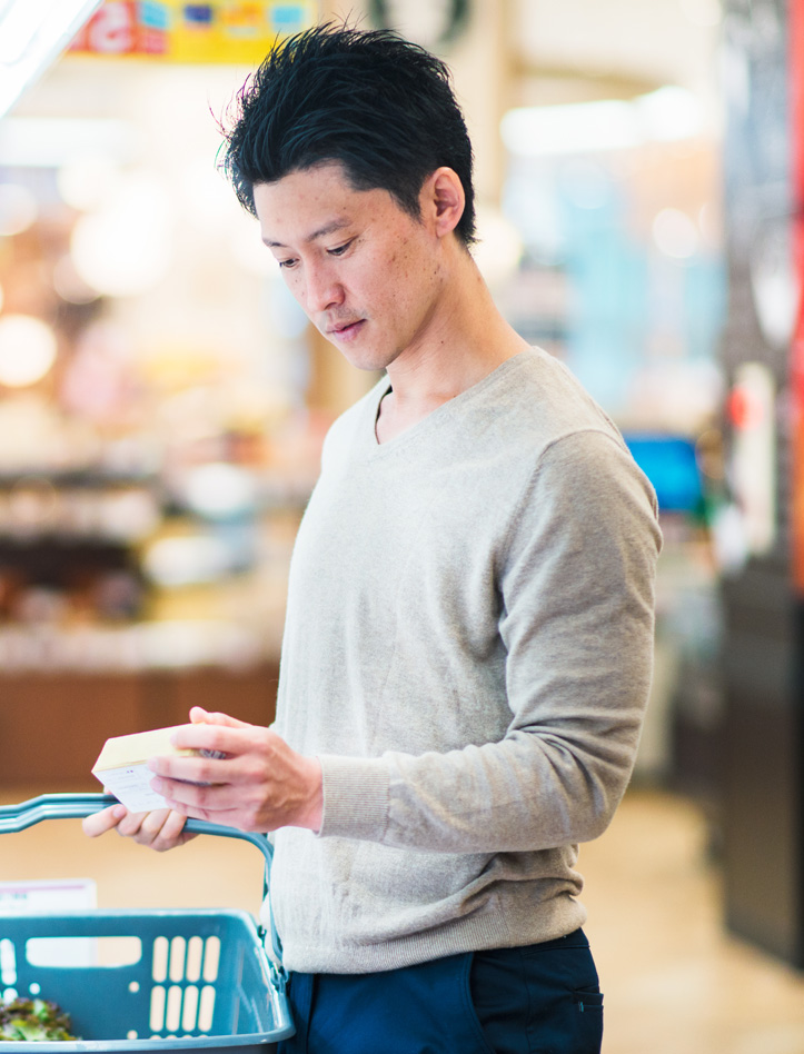 a man shopping in a supermarket