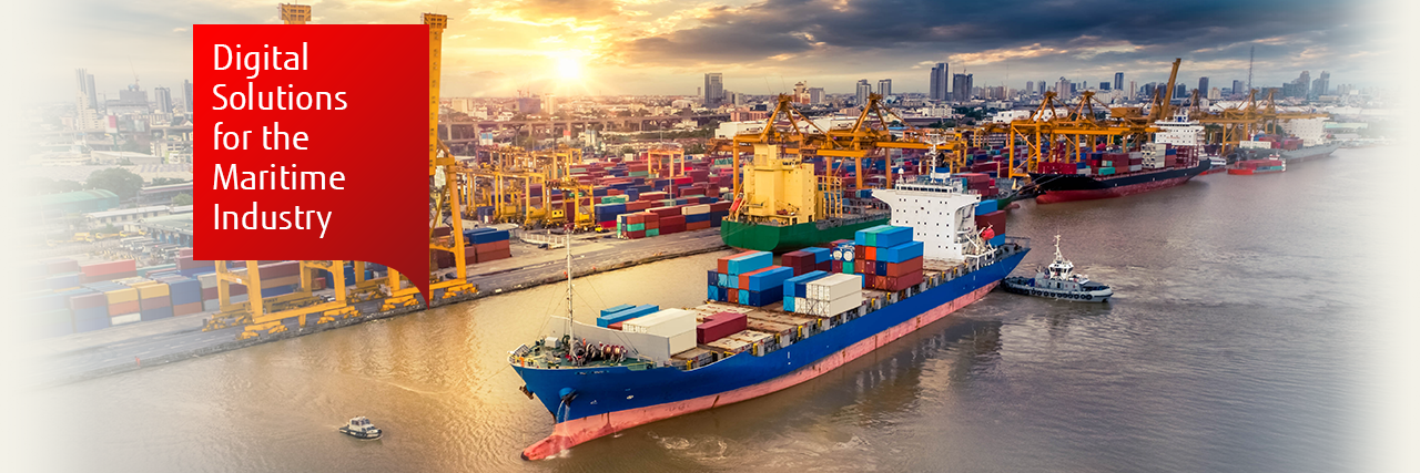 Photo of a cargo ship leaving dock at sunrise