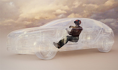 仮想の車を運転している人をイメージした画像。