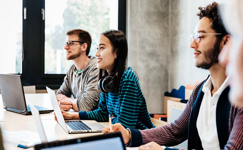 four people working in the office