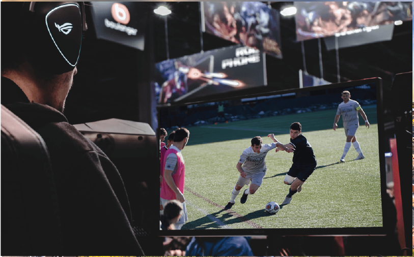 guy watching a game of soccer