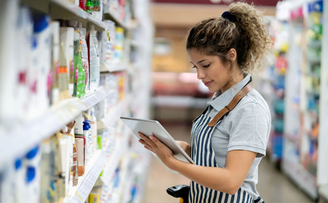 Woman working in shop using a tablet