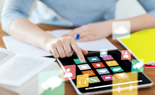 Photo of a woman selecting icons on a tablet screen