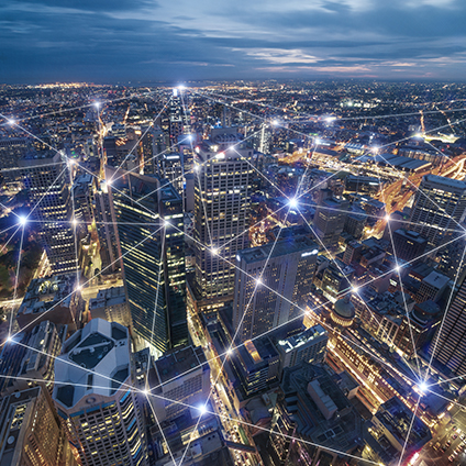A grid of connections over a night cityscape
