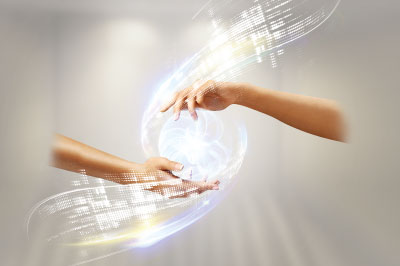 Abstract image of two hands holding a ball of light