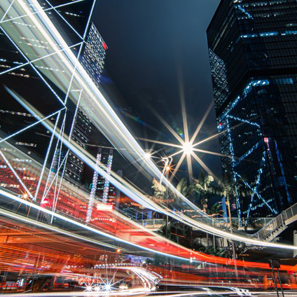 Night-time cityscape with light trails